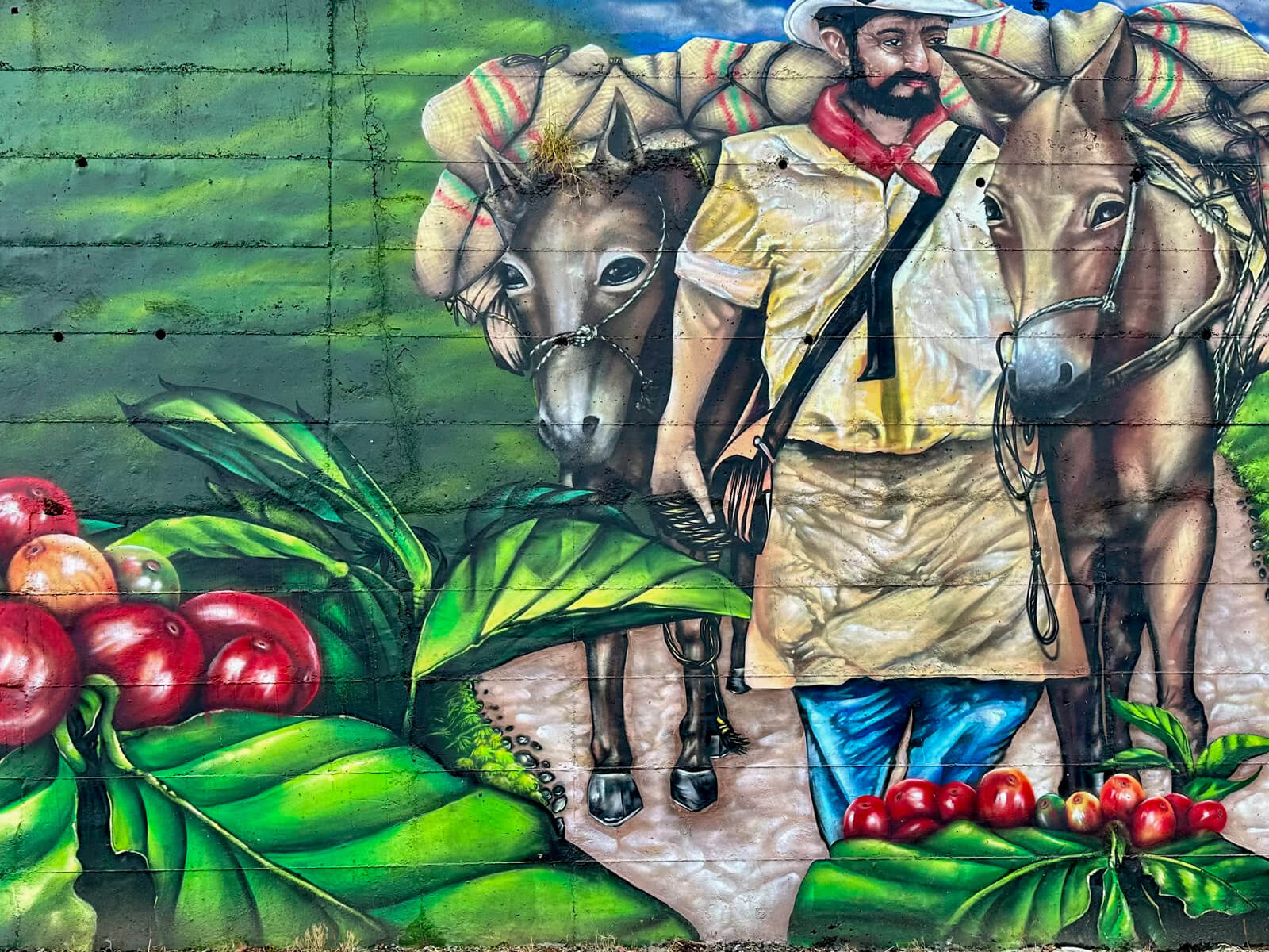 Mural mit Kaffeebauern und Eseln